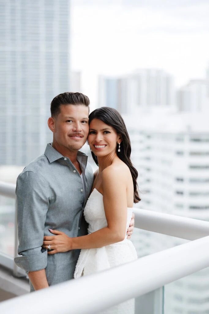 Real Bride posing with her husband on balcony