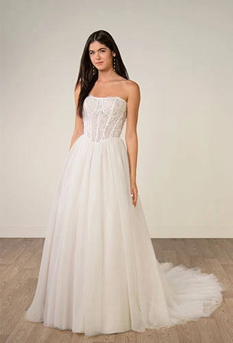 Bride wearing strapless lace and tulle a-line wedding dress with beaded corset
