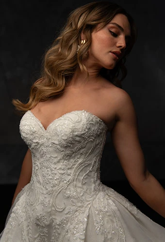 Bride wearing strapless ballgown wedding dress with sweetheart neckline and beaded lace details