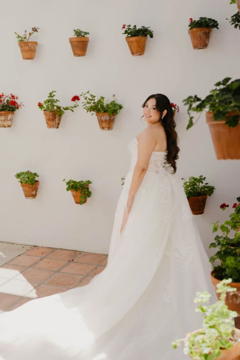 Real bride Maria posing in her wedding gown