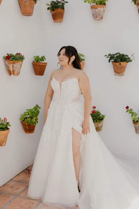 Real bride Maria posing in her wedding gown