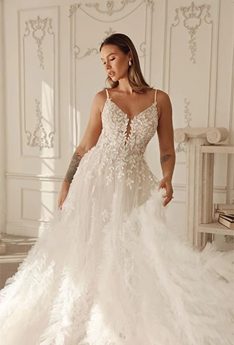 Bride wearing lace a-line wedding dress with 3D florals and v-neckline