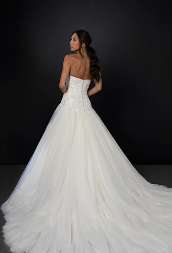 Bride wearing strapless ballgown wedding dress with sparkling lace bodice