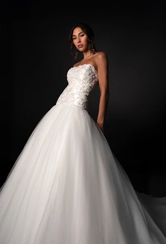 Bride wearing strapless ballgown wedding dress with sparkling lace bodice