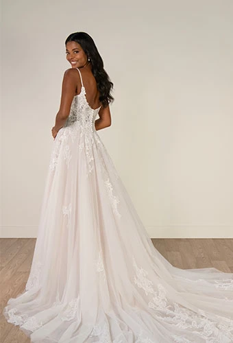Bride wearing lace a-line wedding dress with beaded details
