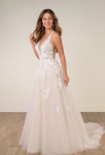 Bride wearing lace wedding dress with v-neckline and shoulder straps