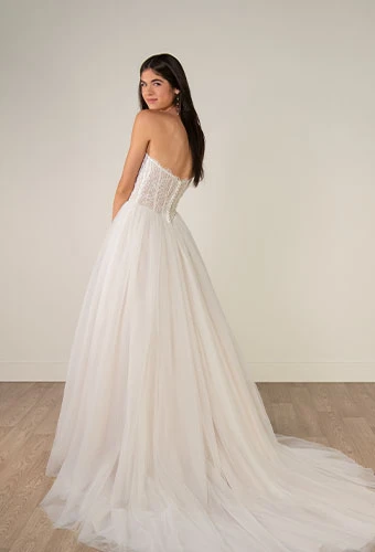 Bride wearing strapless lace and tulle a-line wedding dress with beaded corset