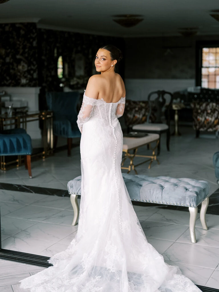 Real bride Alexa posing in her wedding gown