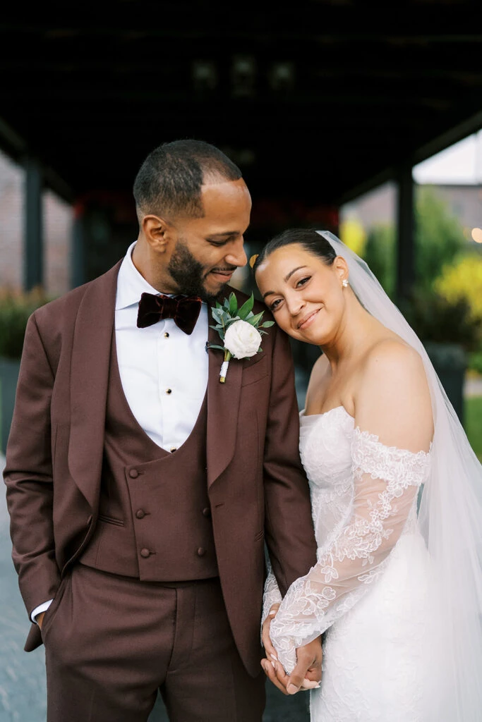 Real bride Alexa posing with her husband