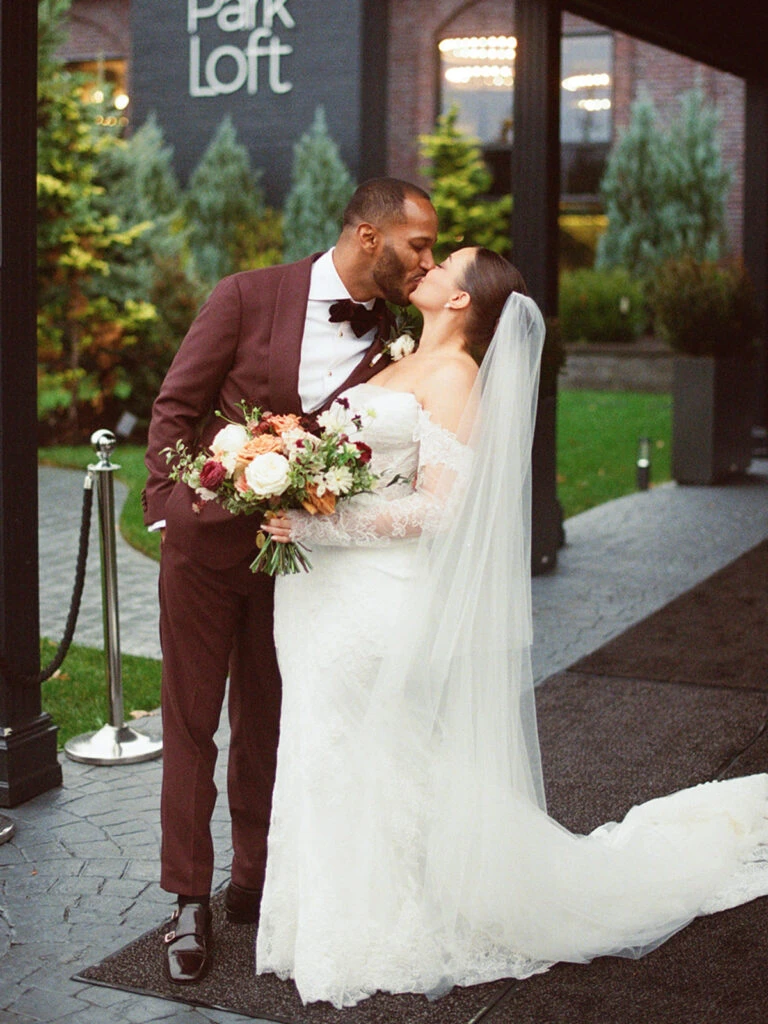 Real Bride Alexa embracing her husband