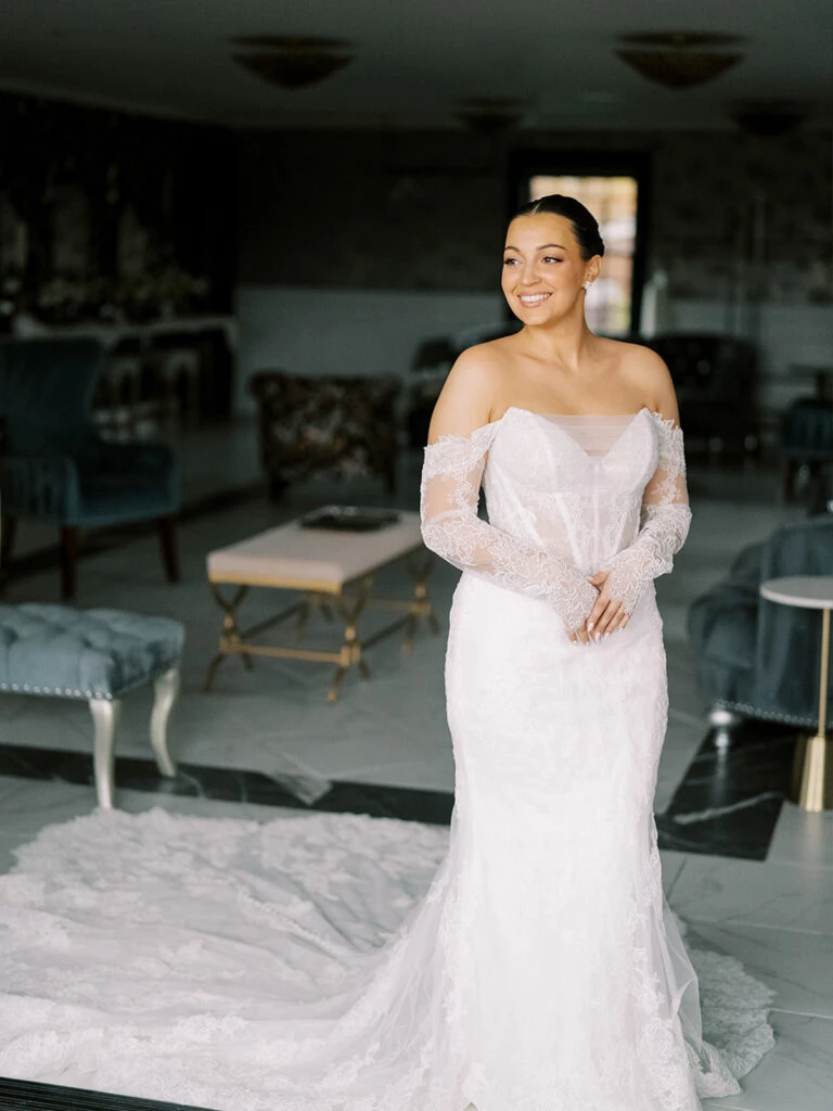 Real bride Alexa posing in her wedding gown