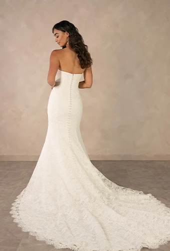 Bride wearing fit-and-flare strapless wedding dress with allover lace