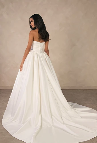 Bride wearing minimalist strapless ballgown wedding dress