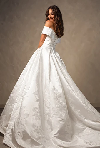 Bride wearing jacquard ballgown wedding dress with off-the-shoulder straps