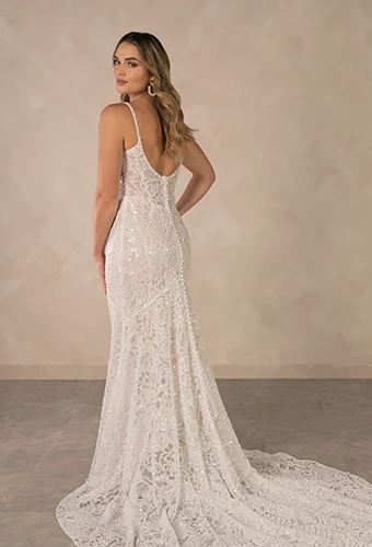 Bride wearing lace sheath wedding dress with beaded spaghetti straps