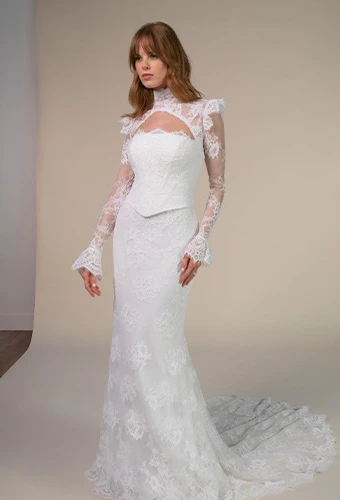 Bride wearing lace wedding gown with long sleeves and high neckline