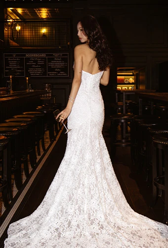 Bride wearing strapless lace fit-and-flare wedding dress