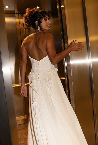 Bride wearing strapless faux two piece wedding dress