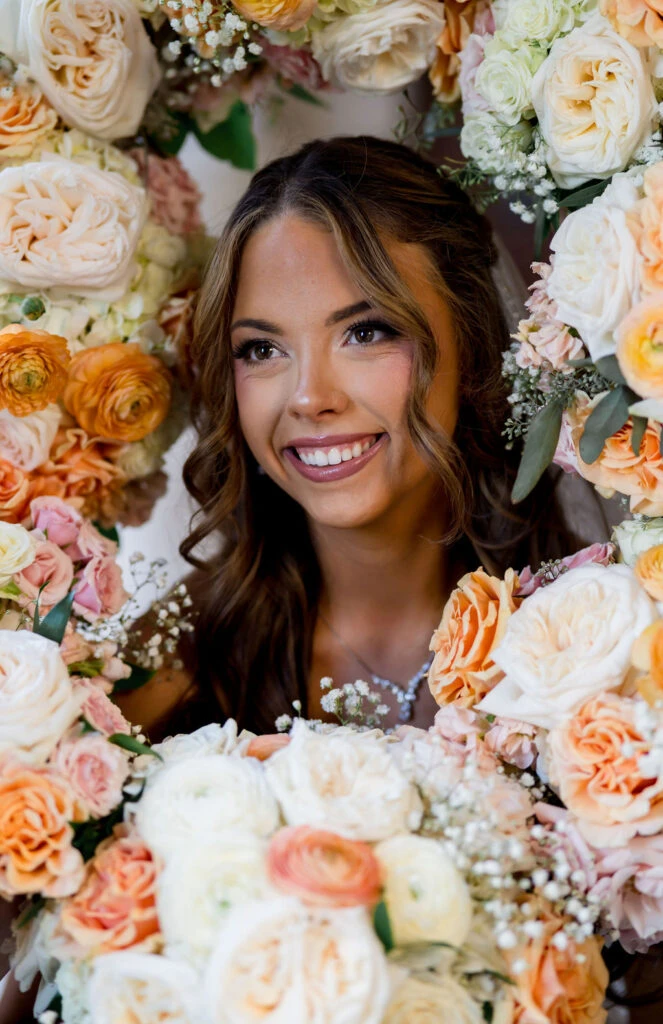 Real bride Janet posing with flowers