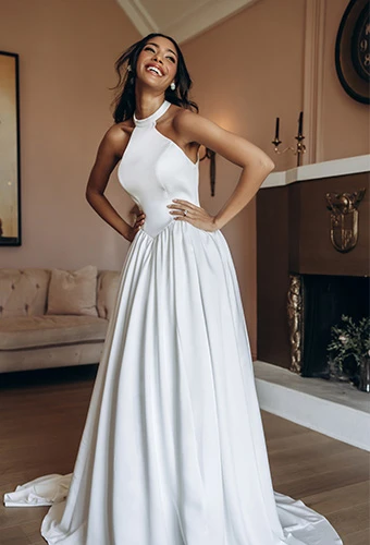 Bride wearing simple a-line wedding dress with high neckline