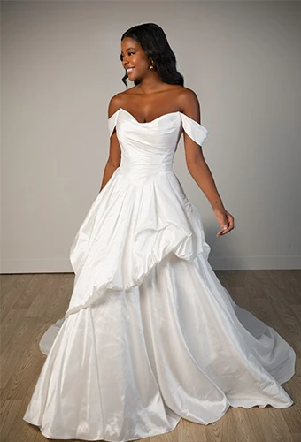 Bride wearing off-the-shoulder ballgown wedding dress with sweetheart neckline and basque waist