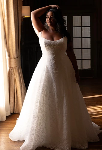 Bride in allover lace a-line gown with sweetheart neckline posed in the sunlight, Essense of Australia D4543.