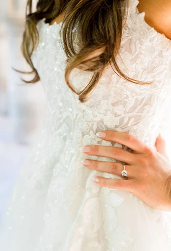 Close up of Real bride Janet Elizabeths wedding gown with lace and beaded detailing