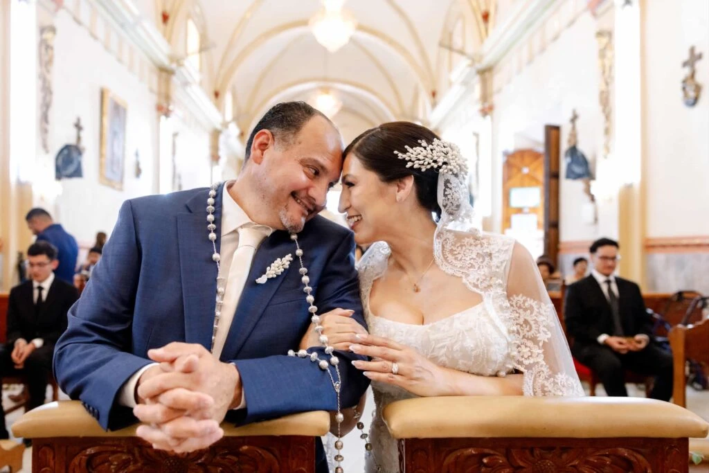 Real bride Clara embracing her husband