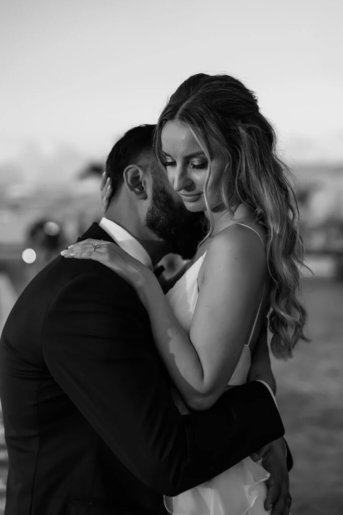 Real bride Mercedez posing lovingly with her husband