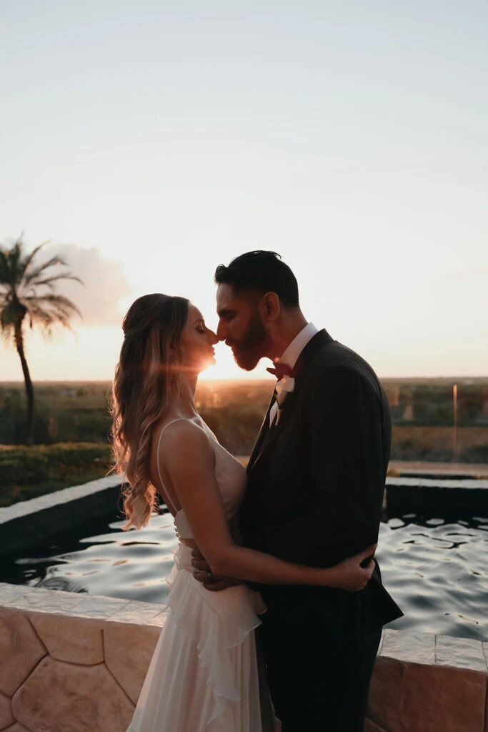 Real bride Mercedez posing lovingly with her husband