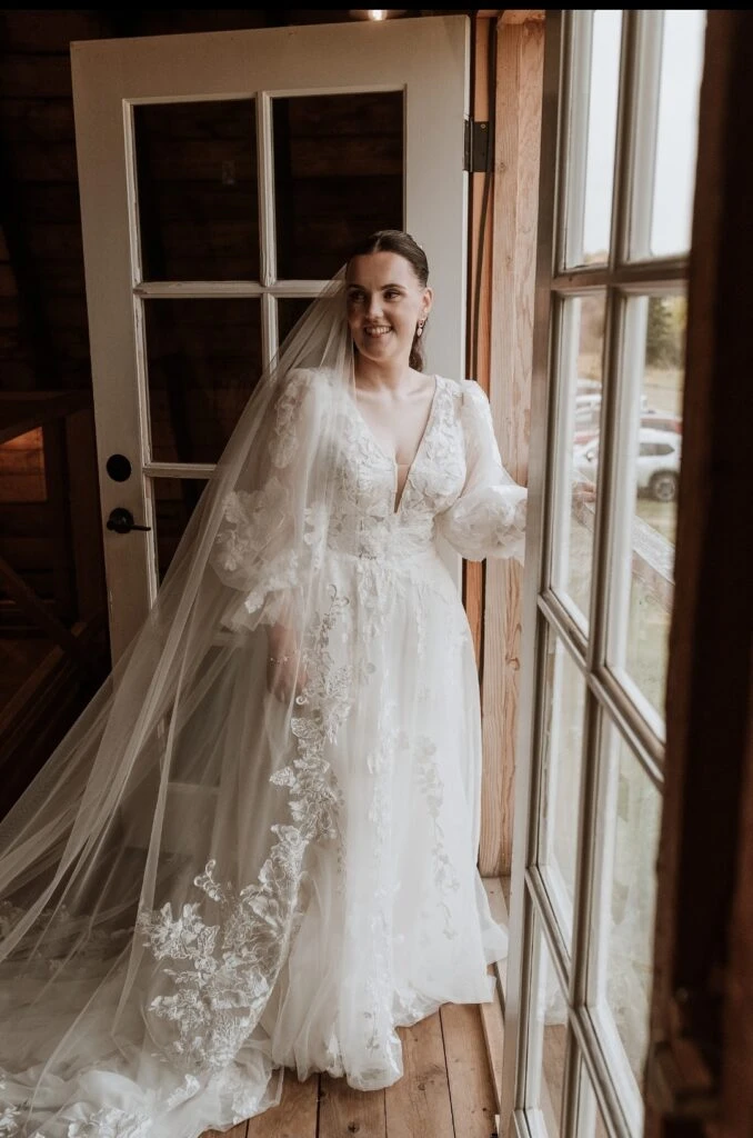 Real bride Kylie posing in her wedding gown