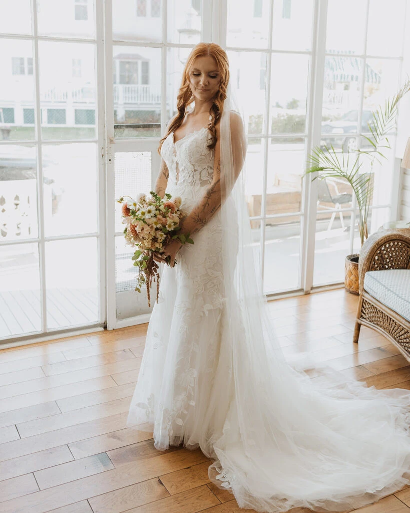 Real bride Mackenzie posing in her wedding gown