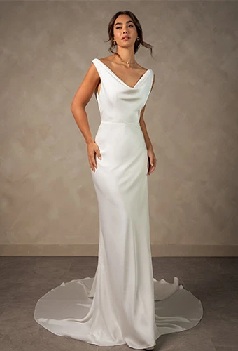 Bride wearing simple column wedding dress with v neckline