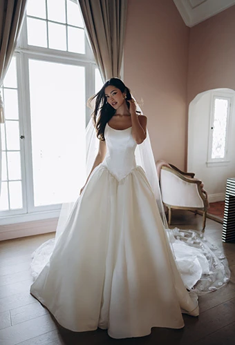 Bride wearing satin drop waist ballgown with scoop neckline, Stella York SY8334