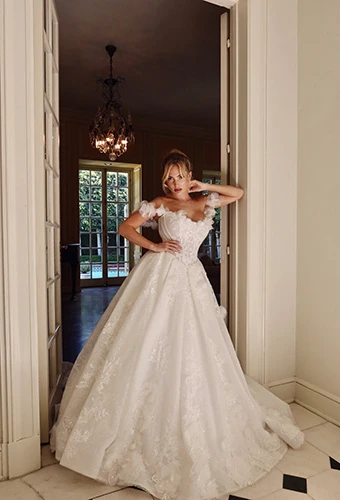Bride wearing romantic princess wedding dress with glitter and floral details, Martina Liana ML1704