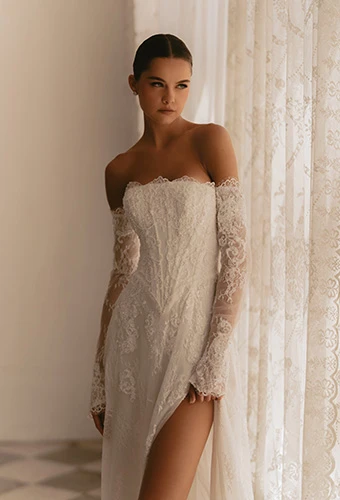 Bride wearing strapless lace basque waist gown with matching sleeves, Martina Liana ML1954