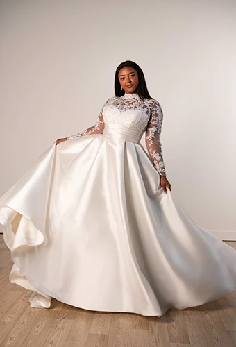 Plus size bride wearing floral lace high neckline a-line wedding gown, Stella York SY8230+