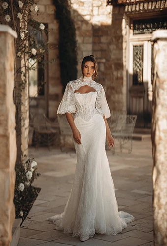 Bride wearing lace and tulle fit-and-flare wedding dress with high-neck cape, Martina Liana ML2010