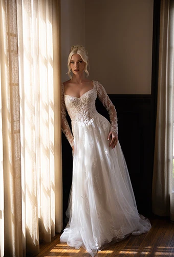 Bride wearing long sleeve a-line wedding dress with floral lace and soft tulle, Essense of Australia D4577