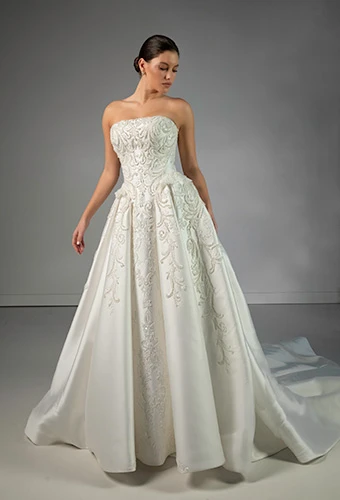 Bride wearing strapless ballgown with swirling lace and pearl bodice details and peplum waist, Martina Liana Luxe LE1492