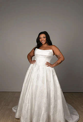 Bride wearing strapless satin princess wedding dress with basque waist, Stella York SY8084+