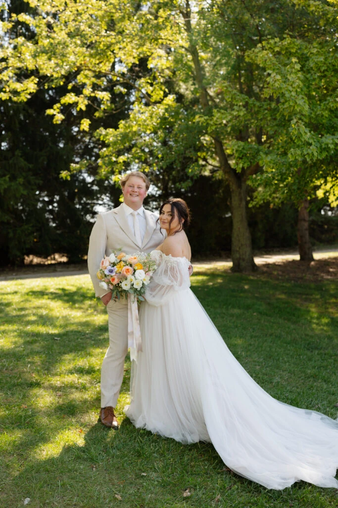 Real bride Emily posing with her husband