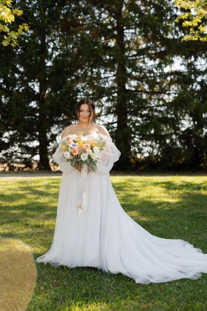 Real bride Emily posing in her wedding gown