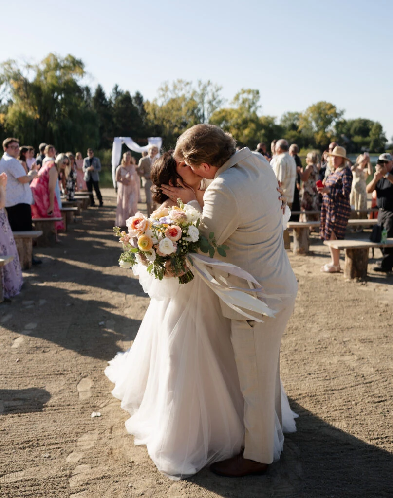 Real bride Emily embracing her husband