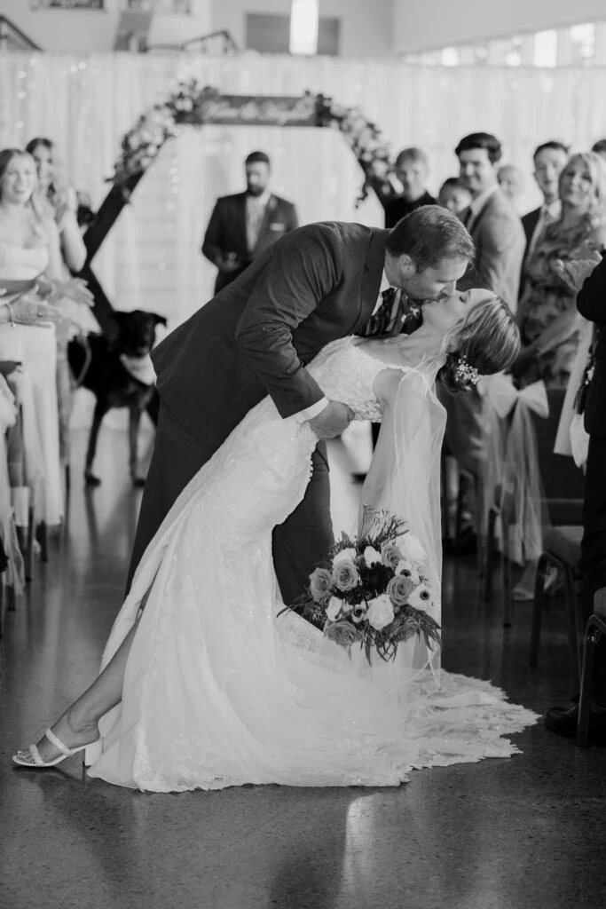 Real bride Kara embracing her husband