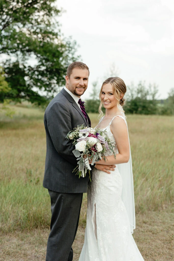 Real bride Kara posing with her husband