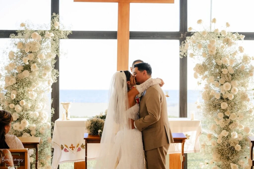 Real bride Sandra embracing her husband