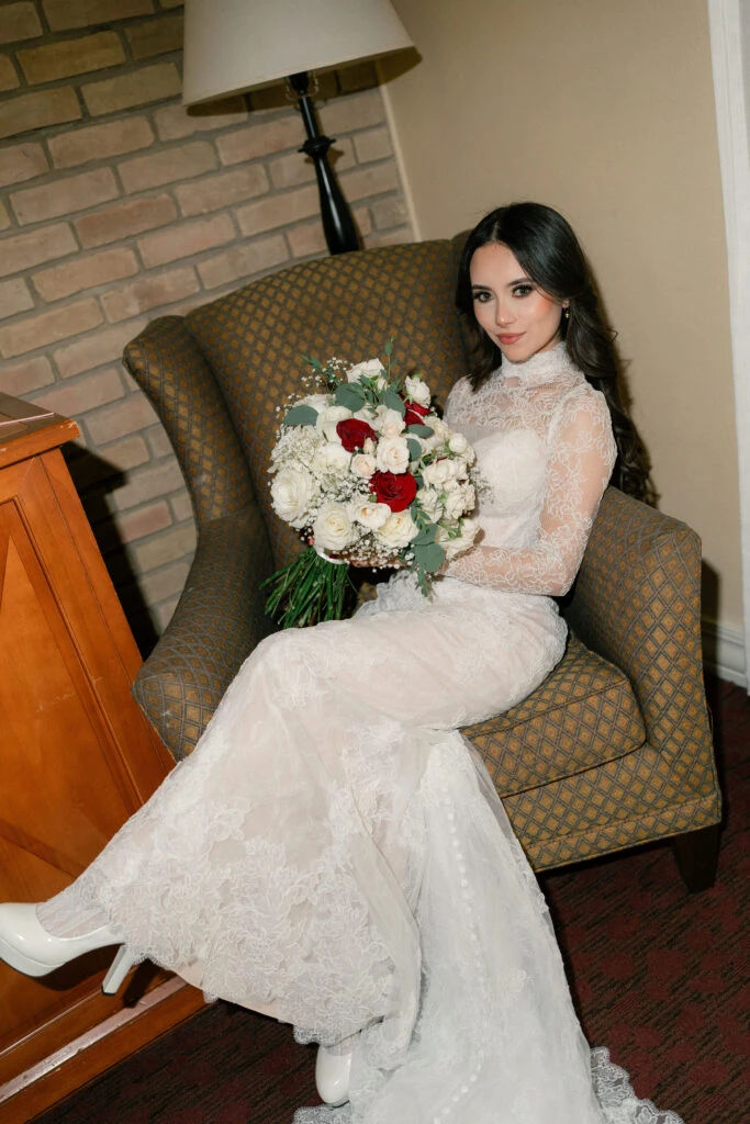 Real bride posing in her wedding gown with a bouquet
