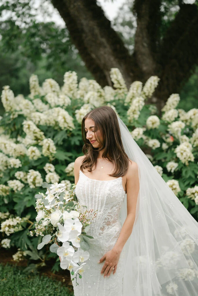Real bride LauraLeigh posing in her wedding gown