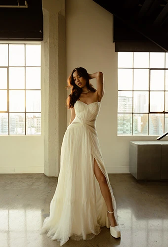 Bride wearing boho strapless wedding dress in chiffon and sheer lace, All Who Wander denver
